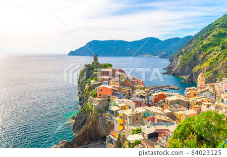 Top aerial view of Vernazza typical village with colorful buildings houses, Castello Doria castle 84023125
