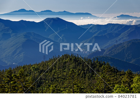 Mt. Akagi in the morning haze seen from the ridgeline of Mt. Naeba and Kagura no Mine in summer 84023781