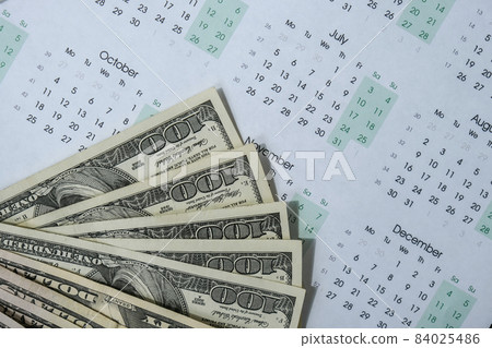 Office workplace desk with dollars and calendar. Counting money for salary. Investment savings. Finances, economy and home concept. Business budget of wealth. Workspace Office workplace desk with dollars and calendar. Counting money for salary. Investment savings. Finances, economy and home concept. Business budget of wealth. Workspace 84025486