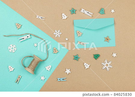 Packing Christmas gifts with blue and brown paper 84025830