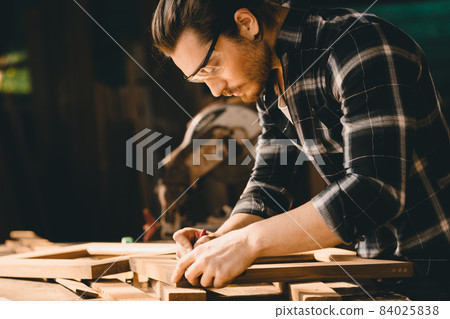 Carpenter man woodcraft working in furniture wood workshop with professional skill real people workman. Carpenter man woodcraft working in furniture wood workshop with professional skill real people workman. 84025838