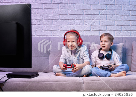 children playing video game with game console children playing video game with game console 84025856