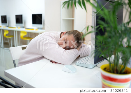 young woman is sad at the workplace. office work concep young woman is sad at the workplace. office work concep 84026841