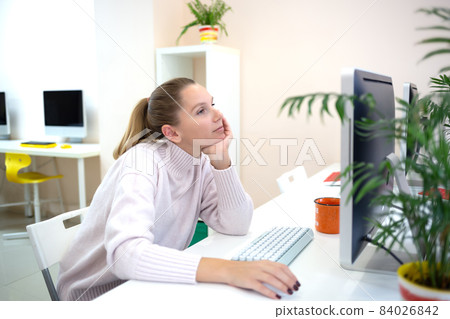 young woman is sad at the workplace. office work concep young woman is sad at the workplace. office work concep 84026842