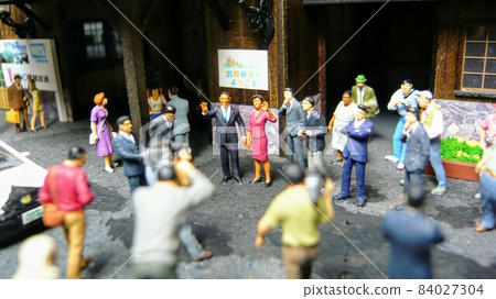 Former President and Mrs. Obama diorama standing in front of the wooden station building 84027304