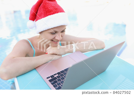 Beautiful woman talk to husband online via video call from holiday Beautiful woman talk to husband online via video call from holiday 84027502