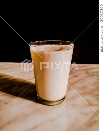 Milk in a glass Milk in a glass 84027860