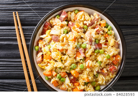 Chinese Egg Fried Rice Yang Chow Fried Rice close up in the plate. Horizontal top view 84028593
