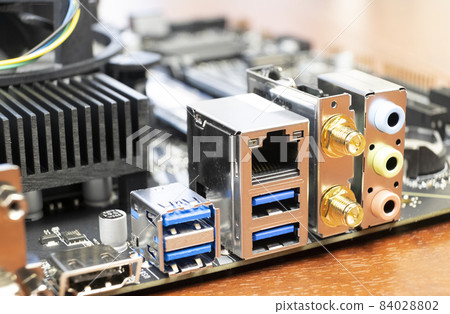 Close up of a desktop computer motherboard. LAN connectors, USB, audio ports Close up of a desktop computer motherboard. LAN connectors, USB, audio ports 84028802