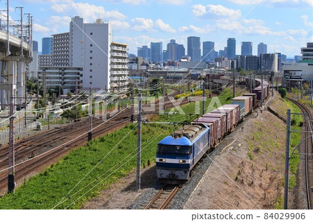 Follow the northern freight line against the backdrop of the skyscrapers of Osaka Follow the northern freight line against the backdrop of the skyscrapers of Osaka 84029906