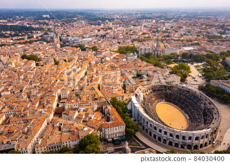 Aerial view of historical area of Nimes overlooking Roman amphitheatre 84030400