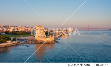 Aerial view of the Portuguese Historical Folk Patrimony, Belem Tower, on the Tagus River. During sunset. Aerial view of the Portuguese Historical Folk Patrimony, Belem Tower, on the Tagus River. During sunset. 84030636