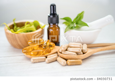 Alternative medicine herbal organic capsule with vitamin E omega 3 fish oil, mineral, drug with herbs leaf natural supplements for healthy good life. 84030731