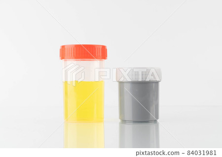 Yellow color urine sample and stool container specimen bottle for check signs of common conditions or diseases on white background. Yellow color urine sample and stool container specimen bottle for check signs of common conditions or diseases on white background. 84031981
