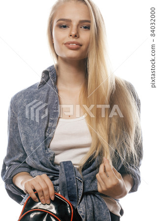 young blond woman on white backgroung gesture thumbs up, isolated emotional posing close up 84032000