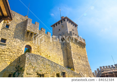 Prima Torre Guaita first medieval tower with stone brick fortress wall with merlons on Mount Titano rock Prima Torre Guaita first medieval tower with stone brick fortress wall with merlons on Mount Titano rock 84032384