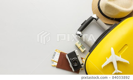 Photo Flat lay yellow luggage with copy space. High quality beautiful photo concept Photo Flat lay yellow luggage with copy space. High quality beautiful photo concept 84033892