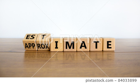 Estimate or approximate symbol. Turned wooden cubes and changed the word 'approximate' to 'estimate'. Beautiful wooden and white background, copy space. Business, estimate or approximate concept. Estimate or approximate symbol. Turned wooden cubes and changed the word 'approximate' to 'estimate'. Beautiful wooden and white background, copy space. Business, estimate or approximate concept. 84033899