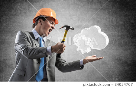 Furious businessman going to crash glass cloud 84034707