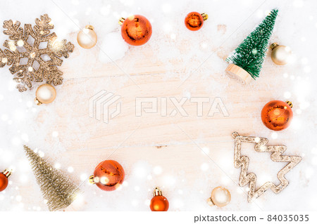 Snow wood. Winter wooden decoration background. Christmas board with old rustic wall, white frozen snowflake, golden balls and gift box. Merry Christmas holiday card pattern. 84035035