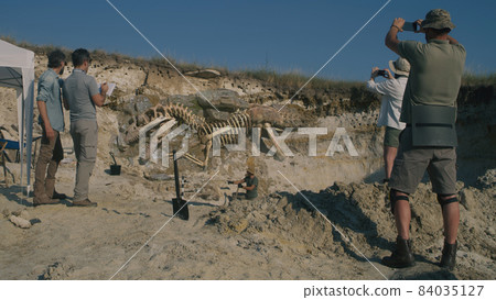Archaeologists working on digging site 84035127