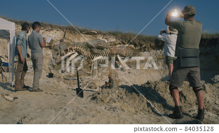 Archaeologists working on digging site 84035128