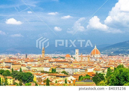 Top aerial panoramic view of Florence city with Duomo Cattedrale di Santa Maria del Fiore cathedral 84035236
