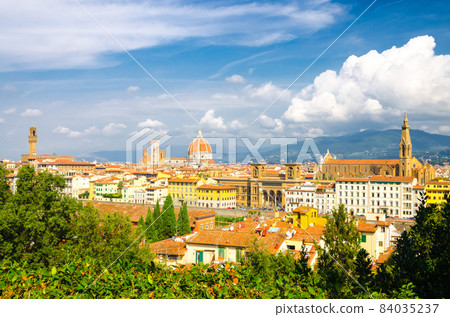 Top aerial panoramic view of Florence city with Duomo Cattedrale di Santa Maria del Fiore cathedral 84035237