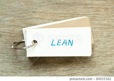 Flash card with handwriting word lean on wood background 84035382