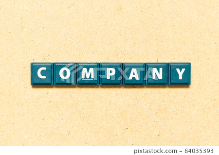 Tile alphabet letter in word company on wood background 84035393