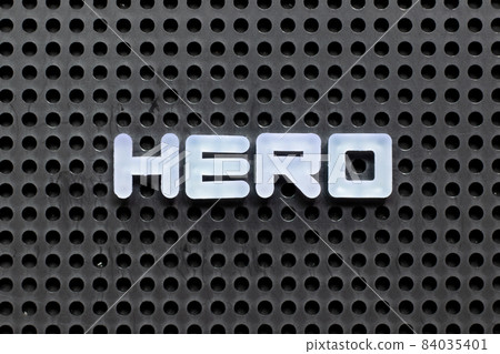 White color letter in word hero on black pegboard background 84035401