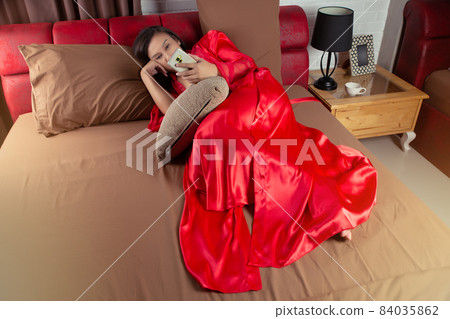 Woman using smartphone Woman using smartphone 84035862