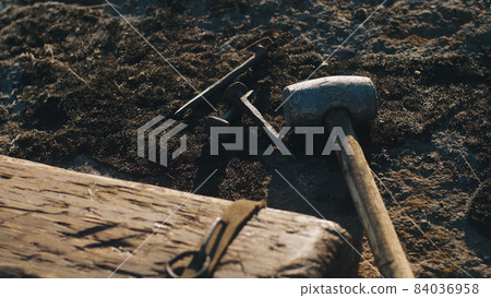 Tools and cross prepared for crucifixion 84036958