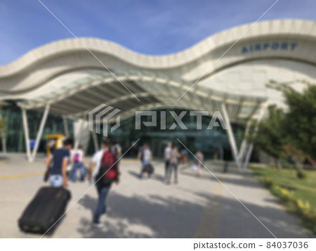 Blurred background with people entering into a airport 84037036