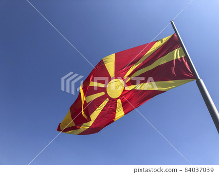 Republic of North Macedonia flag waving on sky 84037039