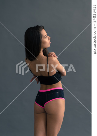 Young and beautiful dancer posing in studio 84039413