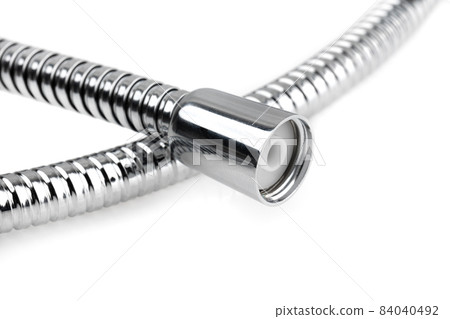 Shower hose on a white background. Silver shower hose close-up. 84040492