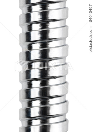 Shower hose on a white background. Silver shower hose close-up. Shower hose on a white background. Silver shower hose close-up. 84040497