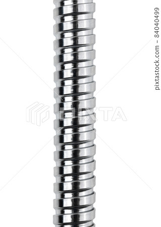 Shower hose on a white background. Silver shower hose close-up. Shower hose on a white background. Silver shower hose close-up. 84040499