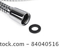 Shower hose on a white background. Silver shower hose close-up. 84040516