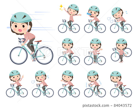 騎著公路自行車的粉色球衣中年婦女 騎著公路自行車的粉色球衣中年婦女 84043572