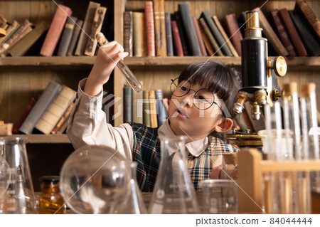 Girl studying and studying in an antique room 84044444