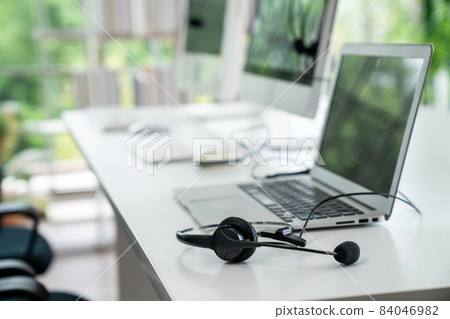 Headset and customer support equipment at call center ready for actively service Headset and customer support equipment at call center ready for actively service 84046982