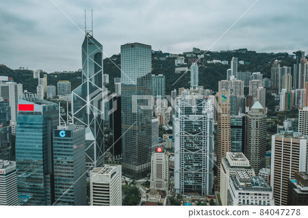 Aerial drone shot a Hong Kong Corporate Buildings streets. Aerial drone shot a Hong Kong Corporate Buildings streets. 84047278