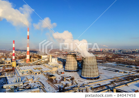 View of pipes of heating station from above on clear winter day. Smoke comes from chimneys. Heating View of pipes of heating station from above on clear winter day. Smoke comes from chimneys. Heating 84047458
