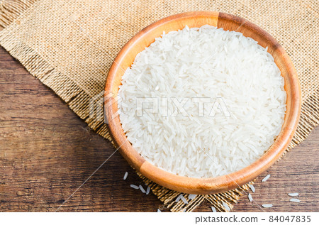 Organic Thai Jasmine rice grain in wooden bowl preparing. 84047835