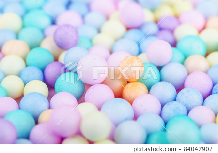 Foam beads of various colors brightly colored. 84047902