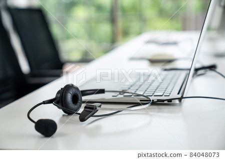 Headset and customer support equipment at call center ready for actively service 84048073