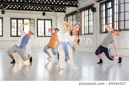 Group of young artists performing street dance Group of young artists performing street dance 84048307