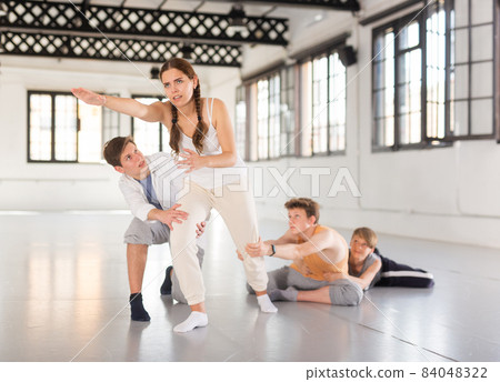 Teenagers training contemporary dance at studio Teenagers training contemporary dance at studio 84048322